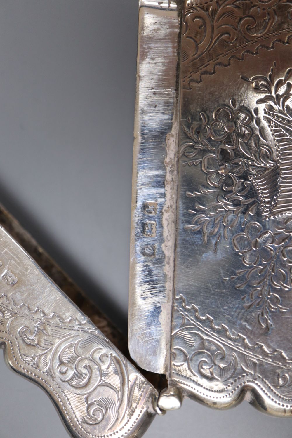 An Edwardian engraved silver card case, Birmingham, 1909, 94mm.